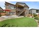 Backyard with patio, low-maintenance turf and garden at 11136 Sweet Cicely Dr, Parker, CO 80134