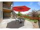 Backyard patio with seating area and stairs leading up to deck at 11136 Sweet Cicely Dr, Parker, CO 80134