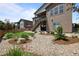 Exterior backyard view showcasing the landscaping, deck stairs and patio at 11136 Sweet Cicely Dr, Parker, CO 80134