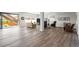 Spacious finished basement with wood flooring, large sliding glass door, and comfortable seating at 11136 Sweet Cicely Dr, Parker, CO 80134