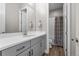 Bathroom featuring modern vanity, hardware and walk-in shower at 11136 Sweet Cicely Dr, Parker, CO 80134