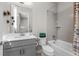 Clean and modern bathroom with a tub, shower, and neutral gray vanity at 11136 Sweet Cicely Dr, Parker, CO 80134
