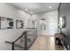 Upper hallway bathed in natural light with stylish decor and contemporary staircase at 11136 Sweet Cicely Dr, Parker, CO 80134