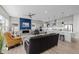 Inviting living space featuring a fireplace, a modern kitchen, and comfortable seating, perfect for entertaining at 11136 Sweet Cicely Dr, Parker, CO 80134