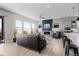 Spacious living area connects seamlessly to a modern kitchen, offering a comfortable space for relaxation and entertainment at 11136 Sweet Cicely Dr, Parker, CO 80134