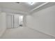 Bright basement with white walls, neutral carpet, access to a bathroom, and ample space for versatile use at 8468 Chase Dr, Arvada, CO 80003