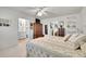 Bedroom featuring a comfortable bed, soft carpet, with an ensuite bathroom and closets at 8468 Chase Dr, Arvada, CO 80003