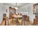 Formal dining room features a classic china cabinet, a wooden table and shuttered windows at 8468 Chase Dr, Arvada, CO 80003