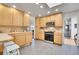 Spacious kitchen with light wood cabinets, modern appliances, tile countertops, and an open layout at 8468 Chase Dr, Arvada, CO 80003