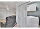 Convenient laundry area with modern appliances, storage, and an organized layout adjacent to the living area at 8468 Chase Dr, Arvada, CO 80003