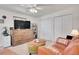 Comfortable living area features a murphy bed, closet space and plush furniture for relaxation and convenience at 8468 Chase Dr, Arvada, CO 80003