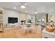 Bright living room features a fireplace, a large TV and a sliding door to the outdoor area at 8468 Chase Dr, Arvada, CO 80003