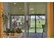 Scenic patio view of the golf course with outdoor seating and lush greenery at 8468 Chase Dr, Arvada, CO 80003