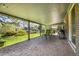 Spacious covered patio with patterned concrete flooring and seating, overlooking a well-maintained green yard at 8468 Chase Dr, Arvada, CO 80003