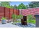 Backyard featuring a decorative rock garden with accent rocks and a unique vertical water feature at 4274 E Dickenson Pl, Denver, CO 80222
