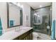 Sleek bathroom with a modern vanity, glass-enclosed shower, and stylish tile work at 4274 E Dickenson Pl, Denver, CO 80222