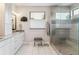 Modern bathroom with glass shower, sleek vanity, and tile flooring at 4274 E Dickenson Pl, Denver, CO 80222