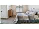 Cozy bedroom with modern decor, soft carpet, and natural light from the window at 4274 E Dickenson Pl, Denver, CO 80222