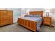Comfortable bedroom featuring a wood frame bed, matching nightstands, and natural light at 4274 E Dickenson Pl, Denver, CO 80222
