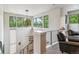 Bright foyer with modern lighting, staircase, and views of the neighborhood at 4274 E Dickenson Pl, Denver, CO 80222