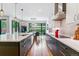 Beautiful kitchen with a large island, stainless steel appliances, and hardwood floors at 4274 E Dickenson Pl, Denver, CO 80222