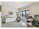 Well-lit office featuring large windows, modern furniture, and ample workspace at 4274 E Dickenson Pl, Denver, CO 80222