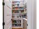 Well-organized pantry with shelving and storage drawers at 4274 E Dickenson Pl, Denver, CO 80222