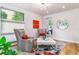 Cozy sitting room with patterned armchairs, geometric rug, and natural light at 4274 E Dickenson Pl, Denver, CO 80222