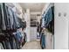 Organized walk-in closet with shelving, drawers, and hanging storage provides ample space at 4274 E Dickenson Pl, Denver, CO 80222