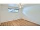 Bright bedroom with hardwood floors, a window, and a ceiling fan at 5563 Newland Way, Arvada, CO 80002