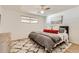 Comfortable bedroom featuring a ceiling fan, hardwood floors, and lots of natural light at 5563 Newland Way, Arvada, CO 80002