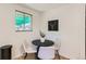 Cozy dining area with a round table, modern chairs, and natural light from the window at 5563 Newland Way, Arvada, CO 80002