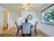 Dining room with hardwood floors and a window at 5563 Newland Way, Arvada, CO 80002