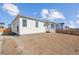 New home with white siding and good-sized, unfinished backyard at 4598 Boone Cir, Brighton, CO 80601