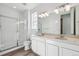 Clean, bright bathroom with double sinks, quartz countertop and glass enclosed shower at 4598 Boone Cir, Brighton, CO 80601