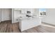 Well-lit kitchen island with a modern design, perfect for meal prep and entertaining at 4598 Boone Cir, Brighton, CO 80601