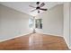 Comfortable bedroom featuring hardwood floors, neutral walls, and a ceiling fan for added comfort and climate control at 8847 Cloverleaf Cir, Parker, CO 80134