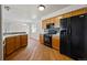 Spacious kitchen featuring oak cabinets, modern appliances, and durable wood flooring, perfect for culinary enthusiasts at 8847 Cloverleaf Cir, Parker, CO 80134