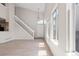 Inviting living room features with large windows, a staircase, and light, wood-look flooring at 8847 Cloverleaf Cir, Parker, CO 80134