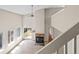 Bright living room featuring a fireplace, large windows and sliding door that offer natural light at 8847 Cloverleaf Cir, Parker, CO 80134