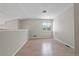 Cozy loft area featuring neutral walls, wood floors, and a bright window at 8847 Cloverleaf Cir, Parker, CO 80134