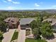 Stunning aerial view of a well-maintained home with lush landscaping and mountain views at 1975 Wild Star Way, Castle Rock, CO 80104