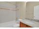 Well-lit bathroom features a shower-tub combo, granite countertops, and neutral wall color at 1975 Wild Star Way, Castle Rock, CO 80104