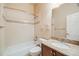 Clean bathroom with granite countertop, decorative tile, and shower-tub combo at 1975 Wild Star Way, Castle Rock, CO 80104