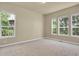 Bedroom with neutral walls, carpet, and windows providing plenty of natural light at 1975 Wild Star Way, Castle Rock, CO 80104