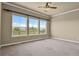 Bedroom with multiple windows showcasing the serene landscape views at 1975 Wild Star Way, Castle Rock, CO 80104