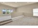 This light-filled bonus room features carpeted floors and multiple windows with great natural light and neighborhood views at 1975 Wild Star Way, Castle Rock, CO 80104