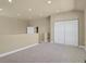 Upstairs bonus room with carpet and a double door closet offers versatile space at 1975 Wild Star Way, Castle Rock, CO 80104