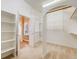 Walk-in closet with custom shelving and storage with easy access to the Primary bathroom at 1975 Wild Star Way, Castle Rock, CO 80104