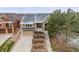 Charming two-story home with a stone facade, tiered front yard landscaping, and a two-car garage at 1975 Wild Star Way, Castle Rock, CO 80104